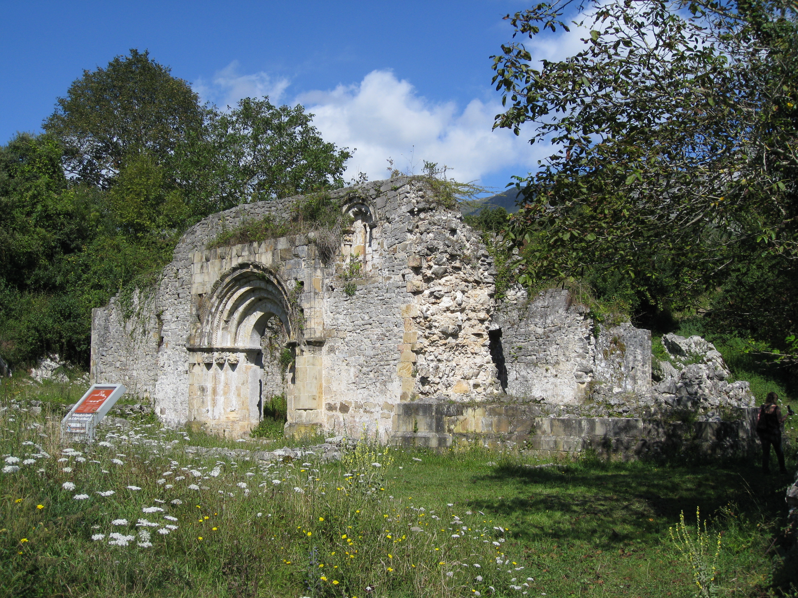 Late-Romanesque (12th century) ruins of the church of San Pedro de Plecín, an Asset of Cultural Interest.